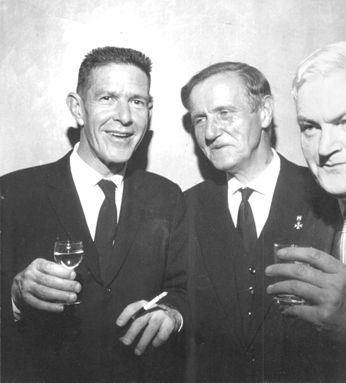 John Cage, Stefan Śledziński and Bolesław Szabelski during a banquet (1964), photo by Andrzej Zborski